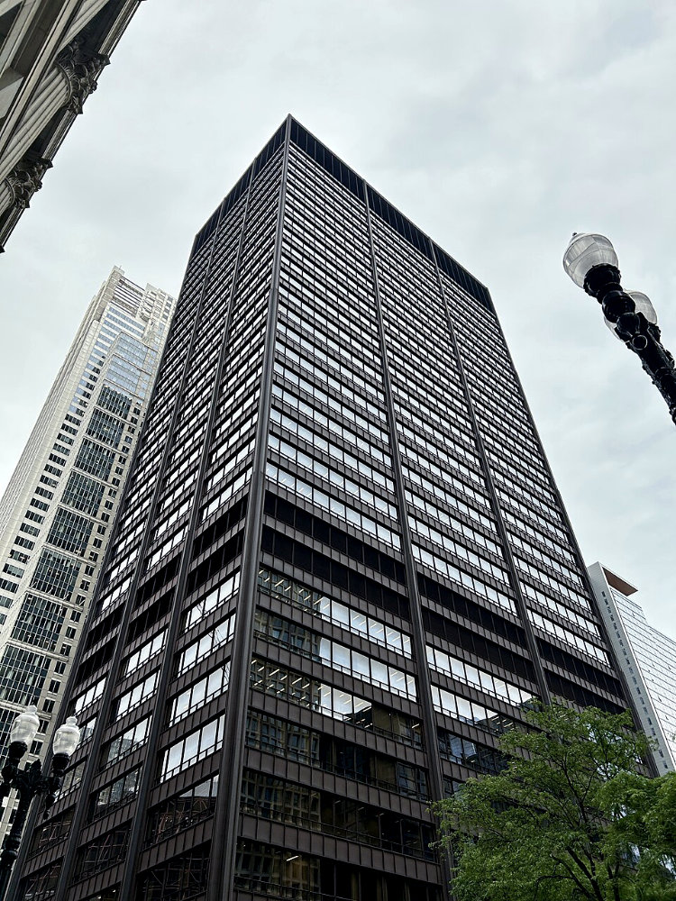 Photo of Chicago's Richard J Daley Center, a large black skyscraper located in the Loop